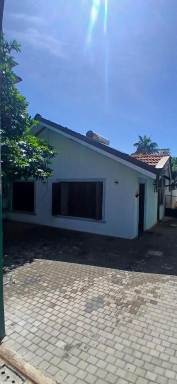 Nordic Villa exterior with paved courtyard