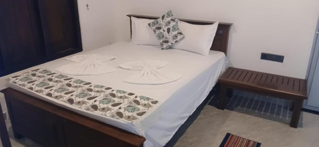Guest room with dressed double bed