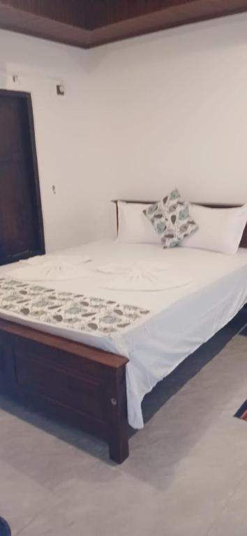 Guest room with white bedding